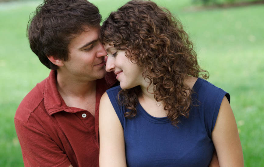 couple sitting close forehead to forehead